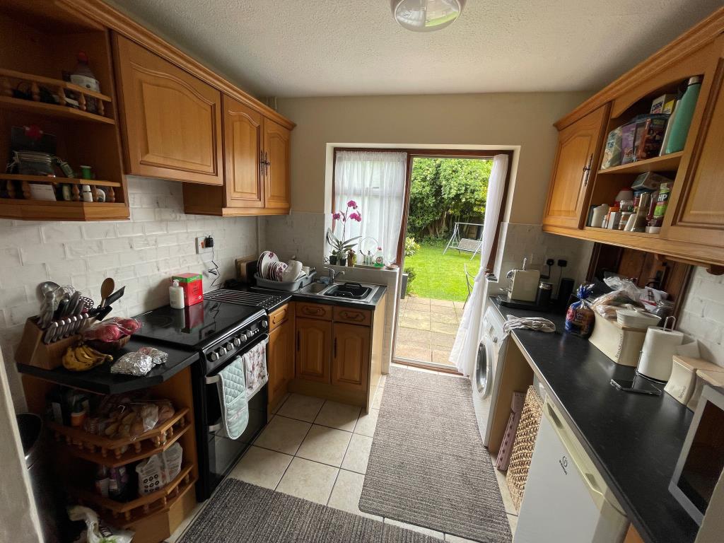 Lot: 48 - THREE-BEDROOM SEMI FOR IMPROVEMENT - Kitchen leading out to garden
